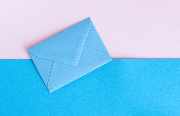 Blue envelope on blue and pink paper