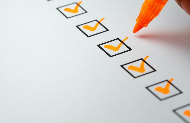 Orange checkmarks on checklist
