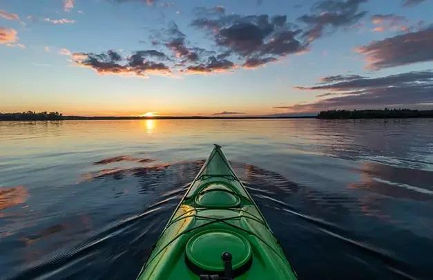 Canoe on a lake during sunset 